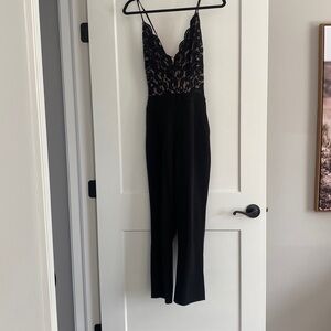 Black lace EXPRESS jumpsuit with pockets size medium